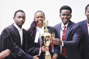 L-R- SoL team, Rodrick Kakwezi, Olga Asianut Blessing with colleague holding the trophy