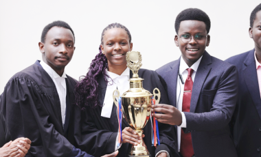 L-R- SoL team, Rodrick Kakwezi, Olga Asianut Blessing with colleague holding the trophy