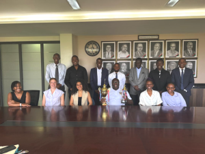 Group photo of Professor Ronald Naluwairo, Dean-SoL (holding trophies) with moot teams and staff